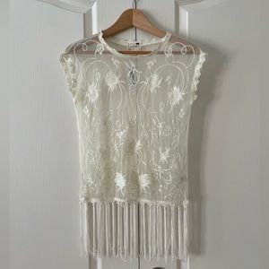 Cute sheer top XS, cream color with fringe on the bottom, new with tags